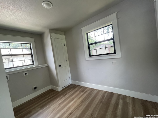 603 Humboldt, San Antonio, TX 78211 - unfurnished bedroom with wood finished floors and a textured ceiling