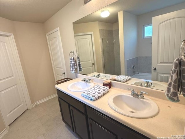 15530 Gray Catbird, San Antonio, TX 78253 - bathroom with double vanity, a stall shower, a garden tub, and tile patterned floors