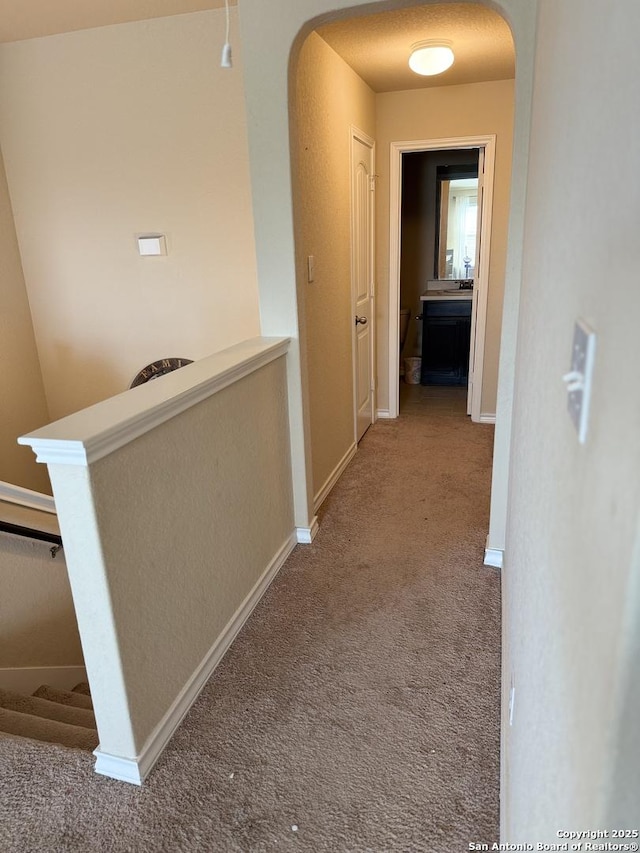 15530 Gray Catbird, San Antonio, TX 78253 - corridor with arched walkways, carpet flooring, and an upstairs landing