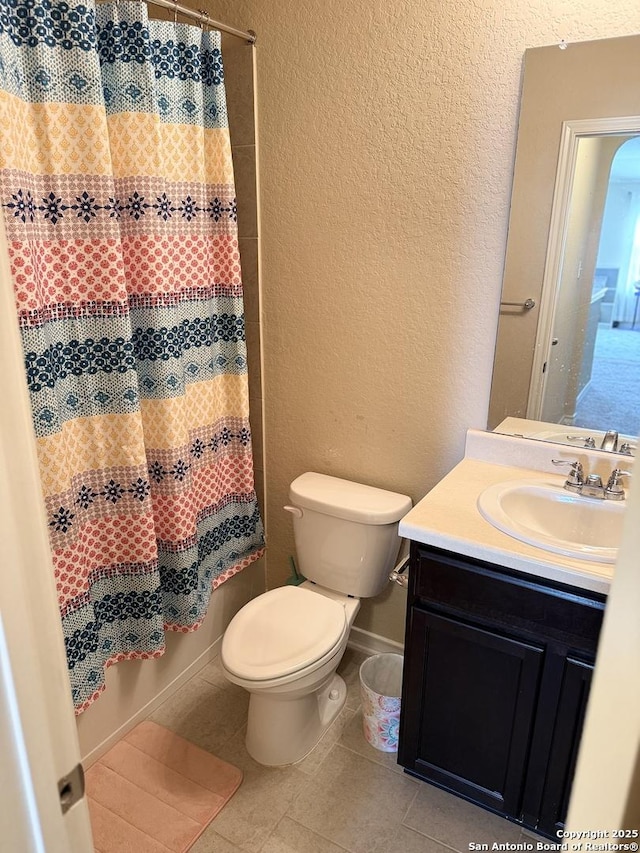15530 Gray Catbird, San Antonio, TX 78253 - full bathroom featuring a textured wall, vanity, tile patterned floors, and a shower with curtain