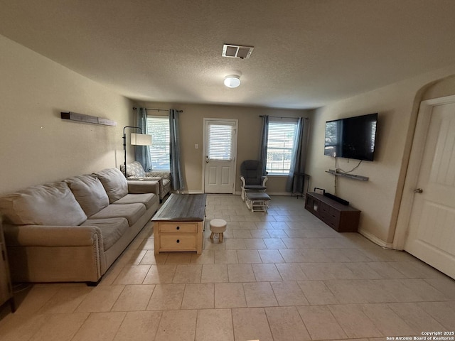 15530 Gray Catbird, San Antonio, TX 78253 - living room with a textured ceiling and light tile patterned floors