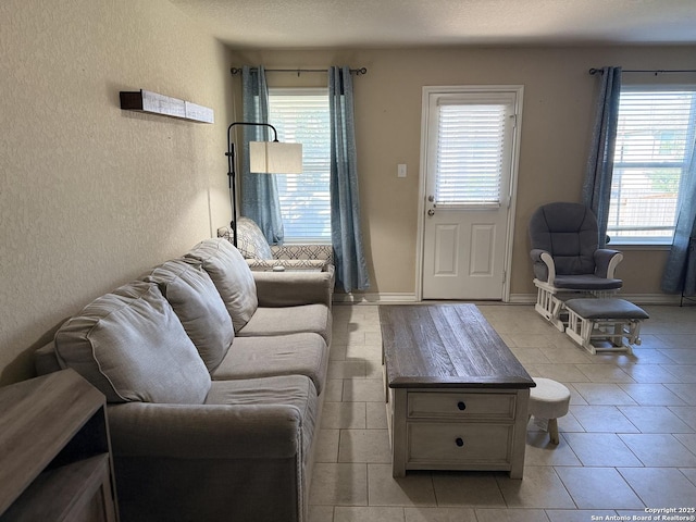 15530 Gray Catbird, San Antonio, TX 78253 - living room featuring light tile patterned floors and a textured wall