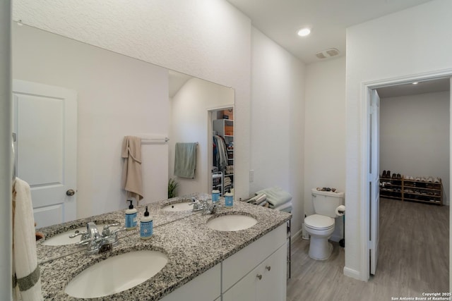 10626 Erinita, Converse, TX 78109 - full bathroom featuring wood finished floors and double vanity