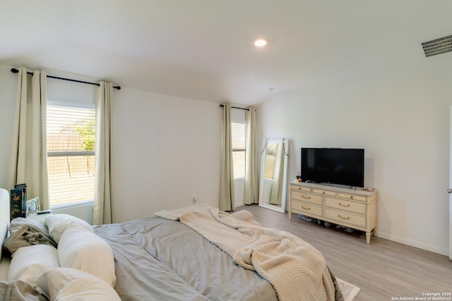 10626 Erinita, Converse, TX 78109 - bedroom with light wood-style flooring, lofted ceiling, and recessed lighting
