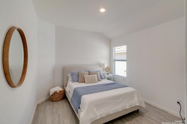 10626 Erinita, Converse, TX 78109 - bedroom with light wood-type flooring, vaulted ceiling, and recessed lighting