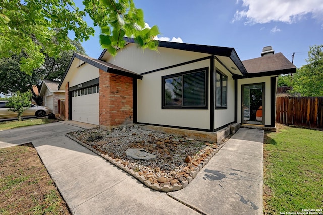 9818 Balanced Rock, Converse, TX 78109 - view of front facade with a garage, driveway, and brick siding