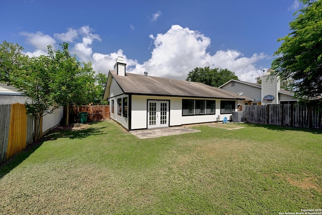 9818 Balanced Rock, Converse, TX 78109 - rear view of property featuring french doors, a chimney, a fenced backyard, roof with shingles, and a patio