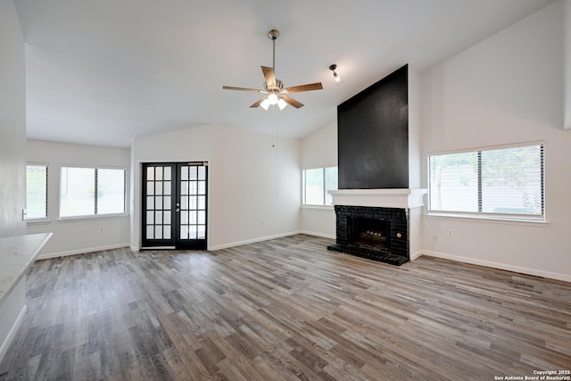 9818 Balanced Rock, Converse, TX 78109 - unfurnished living room featuring wood finished floors, a ceiling fan, high vaulted ceiling, and a fireplace