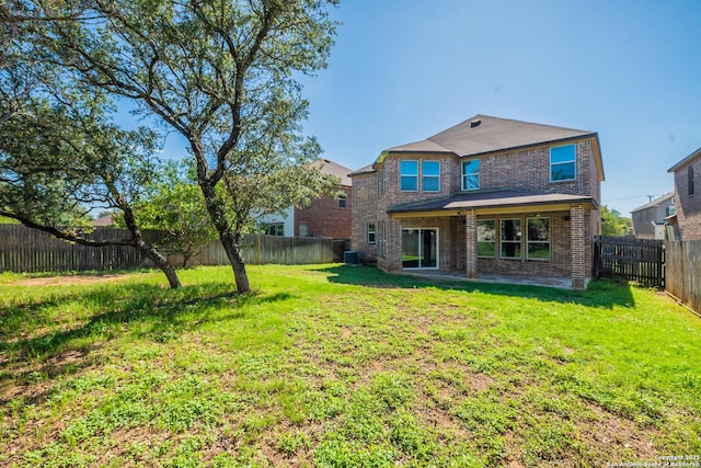 20131 Silver, San Antonio, TX 78259 - rear view of property with brick siding, a fenced backyard, and a patio