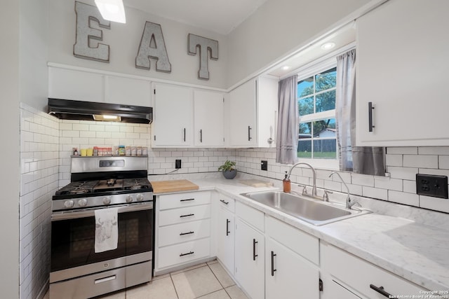 4914 Neer Ave, San Antonio, TX 78213 - kitchen featuring gas stove, under cabinet range hood, white cabinets, backsplash, and light tile patterned floors