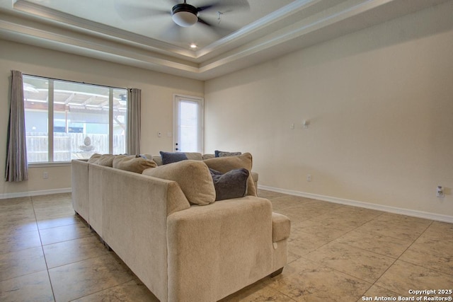 3915 Bacall, Converse, TX 78109 - living area featuring ornamental molding, light tile patterned floors, healthy amount of natural light, a ceiling fan, and a raised ceiling