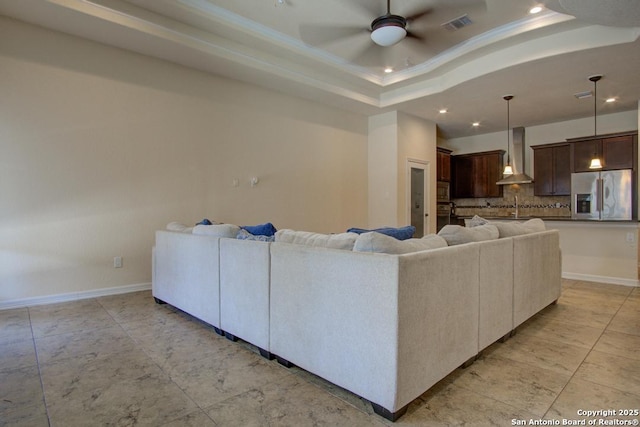 3915 Bacall, Converse, TX 78109 - living area with a raised ceiling, recessed lighting, ceiling fan, and ornamental molding