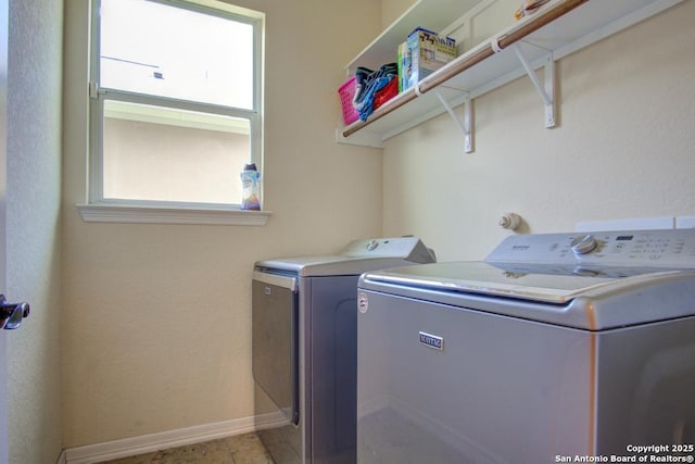 3915 Bacall, Converse, TX 78109 - laundry room with separate washer and dryer and baseboards
