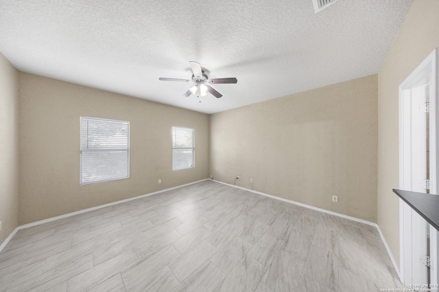 5715 Sendero Spg, San Antonio, TX 78251 - spare room with a ceiling fan and a textured ceiling