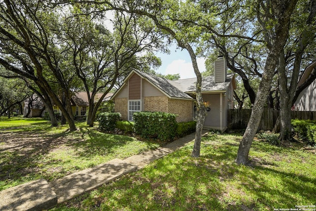 9536 W Dover Rdg, San Antonio, TX 78250 - view of front of home with a chimney and brick siding