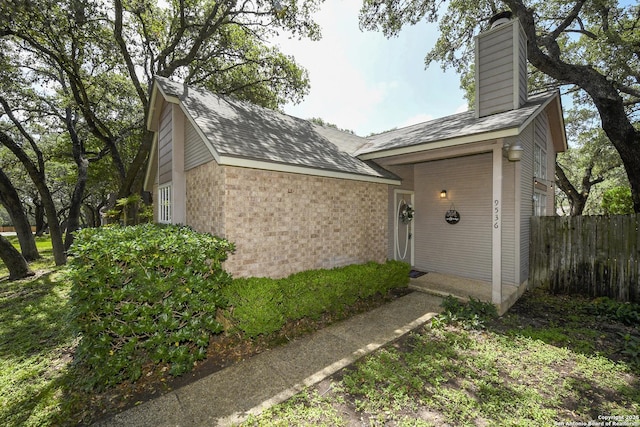 9536 W Dover Rdg, San Antonio, TX 78250 - view of front of home with brick siding and a chimney