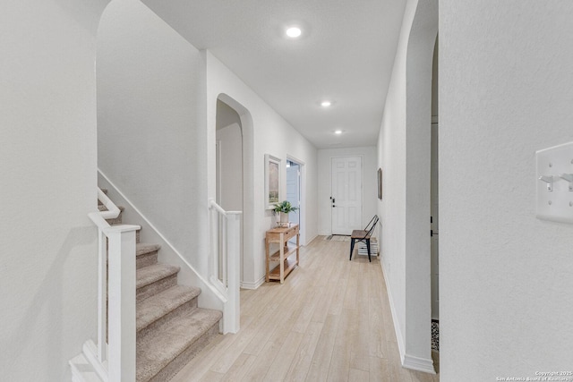 29949 Premiere, Bulverde, TX 78163 - corridor featuring arched walkways, light wood-style floors, recessed lighting, and stairs