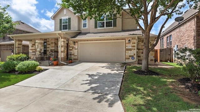 12618 Ozona Rnch, San Antonio, TX 78245 - view of front of house with stone siding, a garage, driveway, and stucco siding