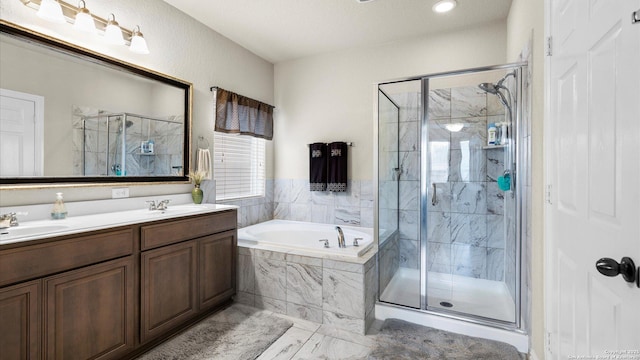 12618 Ozona Rnch, San Antonio, TX 78245 - full bathroom with a bath, a shower stall, and double vanity