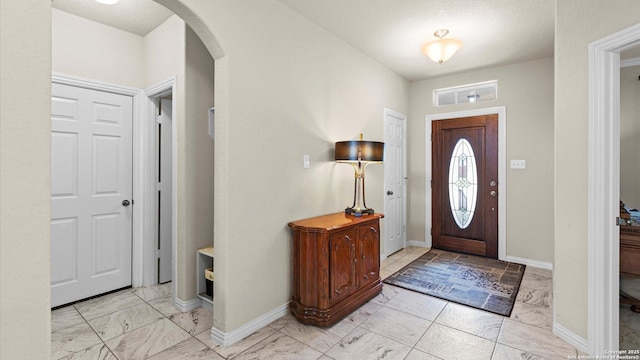 12618 Ozona Rnch, San Antonio, TX 78245 - foyer entrance with arched walkways and light marble finish flooring