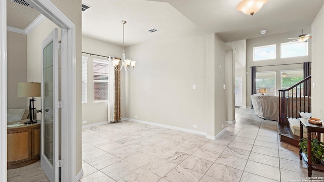12618 Ozona Rnch, San Antonio, TX 78245 - spare room with light marble finish floors, ceiling fan, and a chandelier