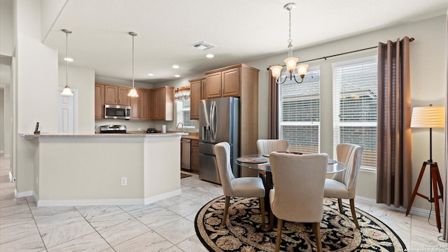 12618 Ozona Rnch, San Antonio, TX 78245 - dining area with light marble finish flooring, plenty of natural light, a chandelier, and recessed lighting