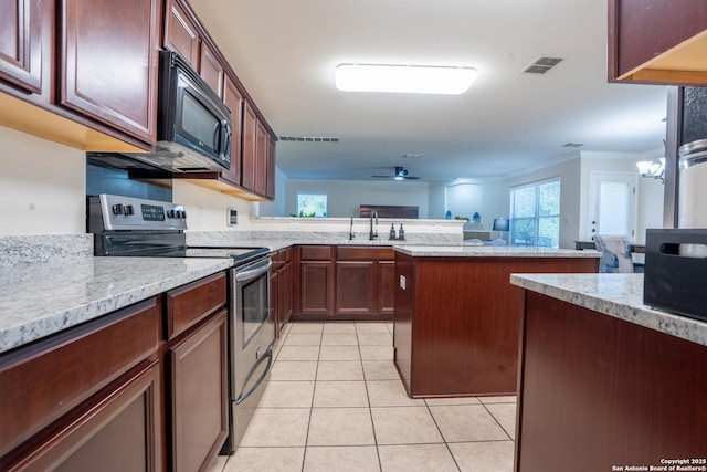 9534 Anderson Way, Converse, TX 78109 - kitchen featuring stainless steel range with electric cooktop, black microwave, crown molding, light tile patterned floors, and a peninsula