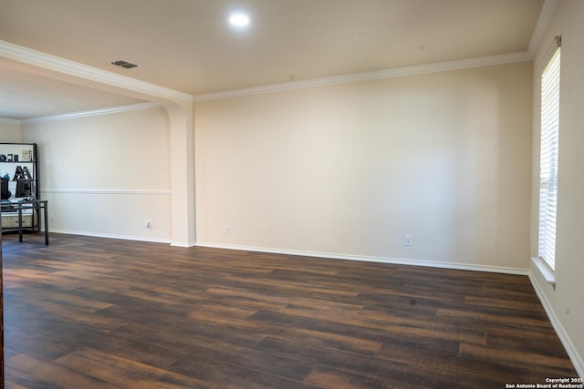 9534 Anderson Way, Converse, TX 78109 - spare room featuring ornamental molding, healthy amount of natural light, and dark wood-style flooring