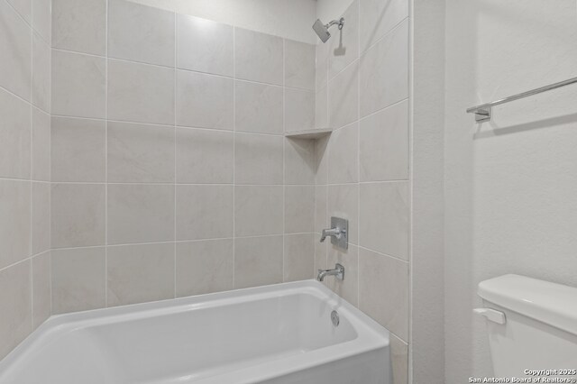 9962 Forestier Grn, San Antonio, TX 78214 - bathroom featuring toilet and shower / bathtub combination