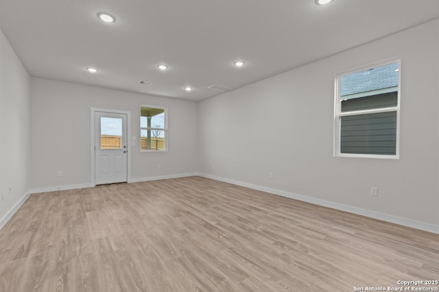 9962 Forestier Grn, San Antonio, TX 78214 - unfurnished room featuring light wood-type flooring and recessed lighting