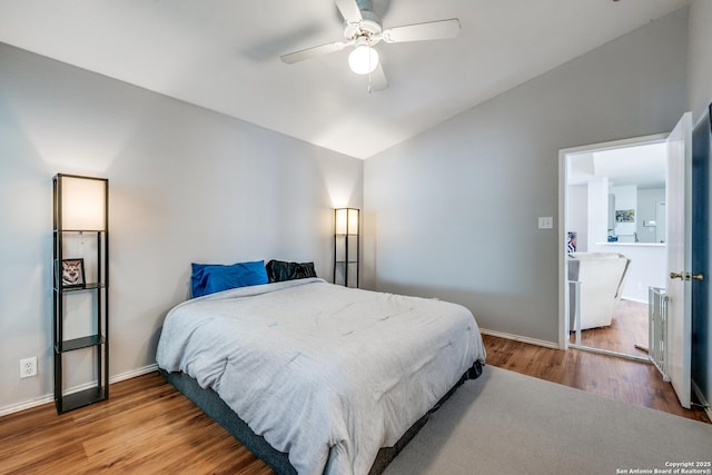 9406 Gillcross, San Antonio, TX 78250 - bedroom featuring lofted ceiling, wood finished floors, and a ceiling fan