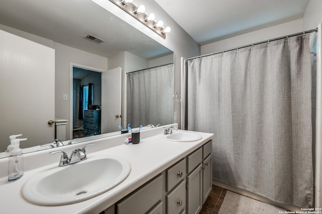9406 Gillcross, San Antonio, TX 78250 - bathroom with double vanity, tile patterned floors, and a shower with curtain