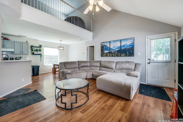 9406 Gillcross, San Antonio, TX 78250 - living room with wood finished floors, a ceiling fan, and high vaulted ceiling