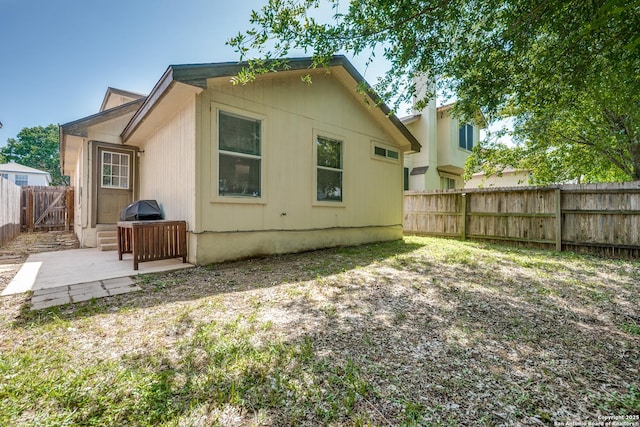9406 Gillcross, San Antonio, TX 78250 - back of house with a fenced backyard and a patio