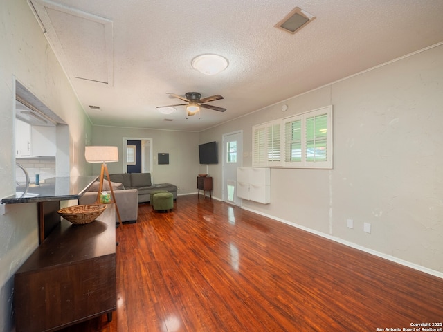 110 W Hermine Blvd, San Antonio, TX 78212 - living area featuring wood finished floors, a ceiling fan, and a textured ceiling