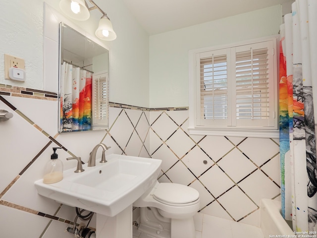 110 W Hermine Blvd, San Antonio, TX 78212 - full bathroom with tile walls, tile patterned floors, and a wainscoted wall