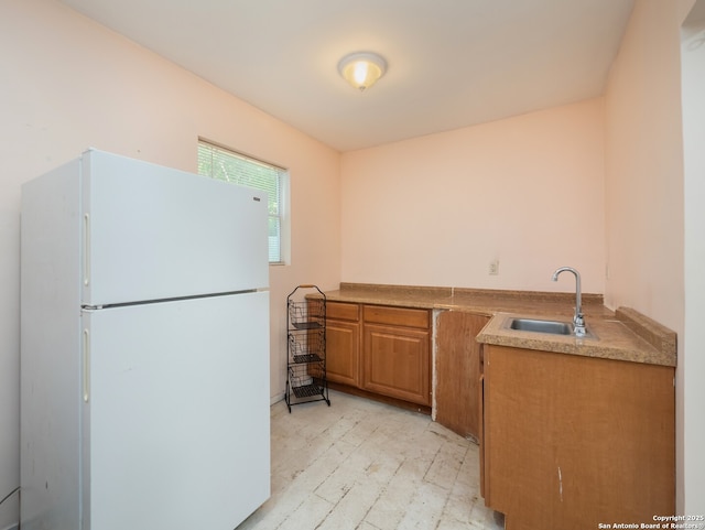 110 W Hermine Blvd, San Antonio, TX 78212 - kitchen featuring freestanding refrigerator and brown cabinets