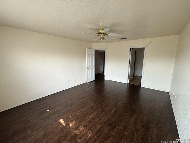 6547 Estes Flts, San Antonio, TX 78242 - spare room featuring dark wood finished floors, ceiling fan, and a textured ceiling