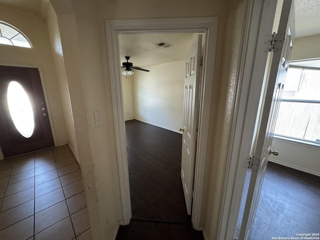 6547 Estes Flts, San Antonio, TX 78242 - foyer entrance with a ceiling fan and a textured ceiling