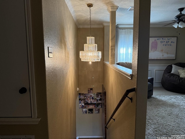 6922 Lunar, Converse, TX 78109 - hallway with a textured wall, crown molding, an upstairs landing, carpet flooring, and a chandelier