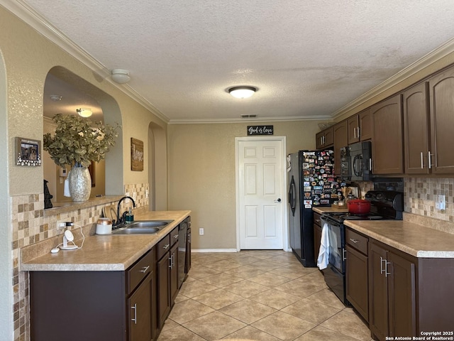 6922 Lunar, Converse, TX 78109 - kitchen with black appliances, arched walkways, light countertops, backsplash, and a textured ceiling
