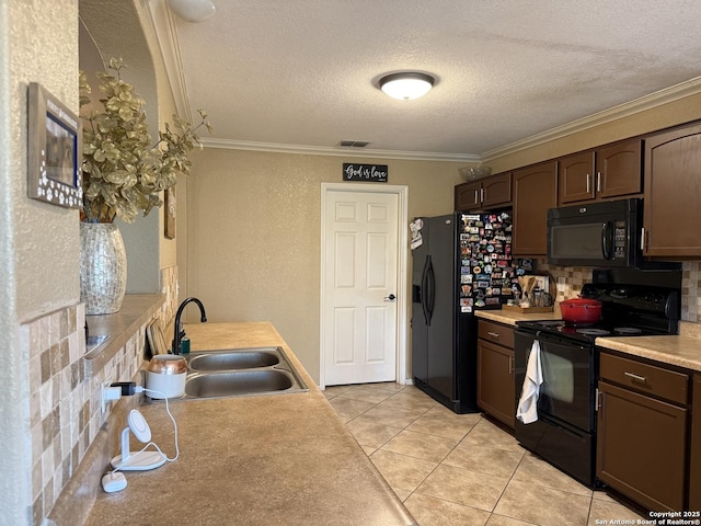 6922 Lunar, Converse, TX 78109 - kitchen featuring black appliances, ornamental molding, a textured ceiling, light countertops, and dark brown cabinets