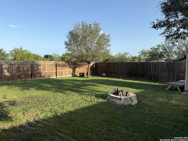 6922 Lunar, Converse, TX 78109 - fenced backyard with a fire pit