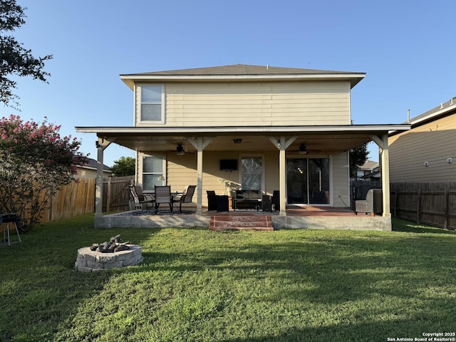 6922 Lunar, Converse, TX 78109 - rear view of property featuring a ceiling fan, a fire pit, a fenced backyard, and a patio