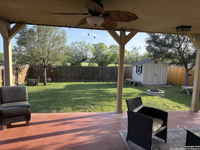 6922 Lunar, Converse, TX 78109 - fenced backyard featuring a storage shed, a ceiling fan, a patio area, and an outdoor fire pit