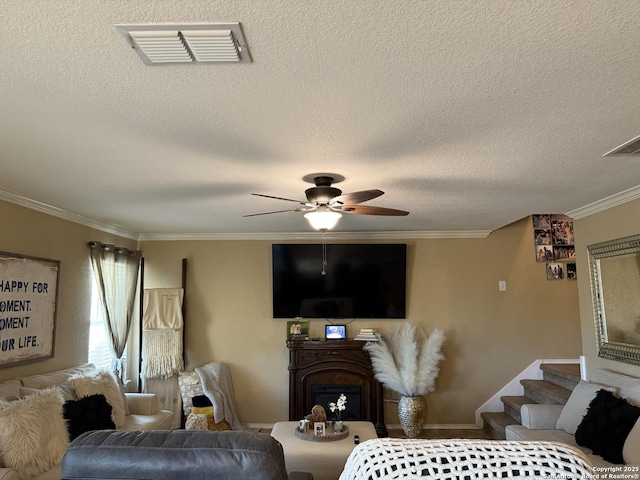 6922 Lunar, Converse, TX 78109 - living room with crown molding, ceiling fan, a fireplace, a textured ceiling, and stairway