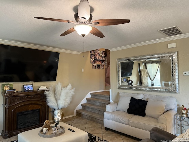 6922 Lunar, Converse, TX 78109 - tiled living room featuring a glass covered fireplace, crown molding, a ceiling fan, a textured ceiling, and stairway