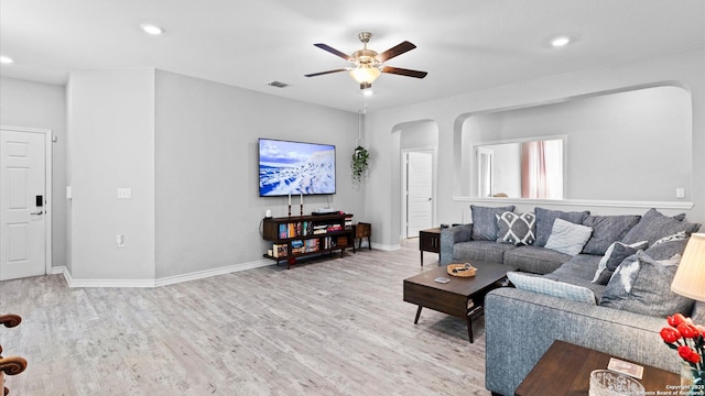 6314 Hibiscus Fls, San Antonio, TX 78218 - living area with arched walkways, light wood-type flooring, a ceiling fan, and recessed lighting