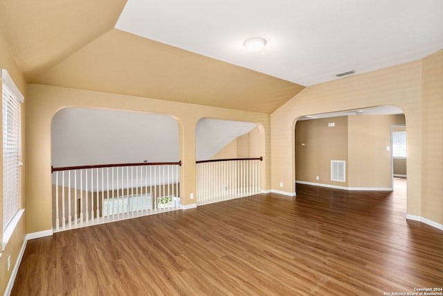 3415 Highline, San Antonio, TX 78261 - unfurnished room featuring lofted ceiling, wood finished floors, and arched walkways