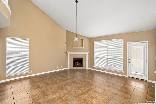 3415 Highline, San Antonio, TX 78261 - unfurnished living room with tile patterned floors, a tiled fireplace, and high vaulted ceiling